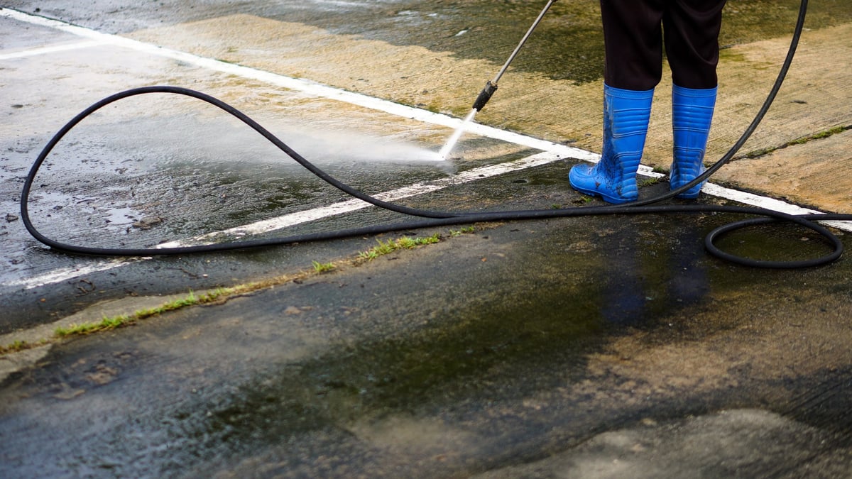 Industrial pressure washing of a building exterior